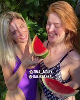 Jia and a friend learn how to eat watermelon