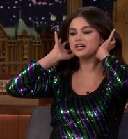 Selena Gomez putting her hair up before giving you a sloppy blowjob