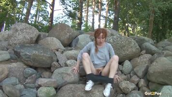 Redhead On The Rocks