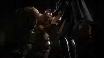 Kano grabs Kitana's by her breasts and headbutts her