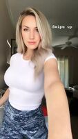 Busty in a tight white shirt.