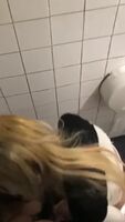 Couple getting wild and rough in the bathroom stall