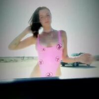 Julia Fox in a pink swimsuit